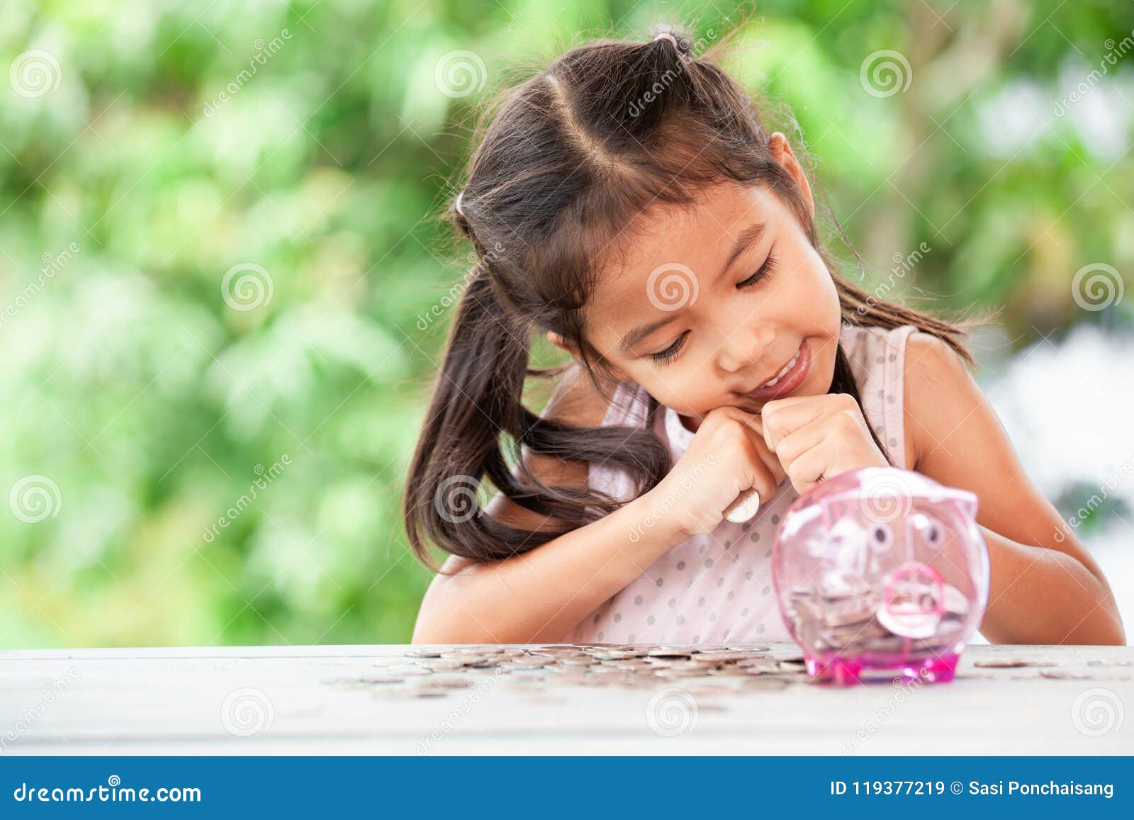 cute asian little child girl stingy her money