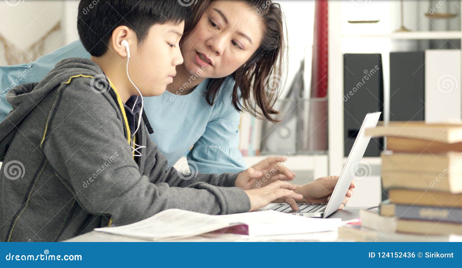 Cute Asian Mother Helping Your Son Doing Your Homework Stock Photo