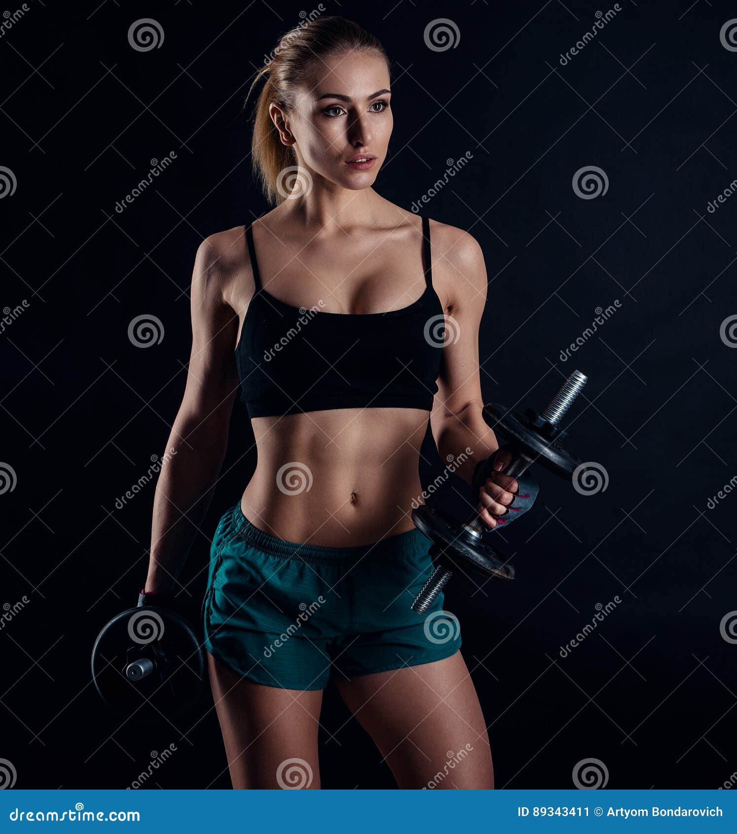 Cute Athletic Model Girl in Sportswear with Dumbbells in Studio Against  Black Background. Ideal Female Sports Figure Stock Image - Image of  equipment, body: 89343411