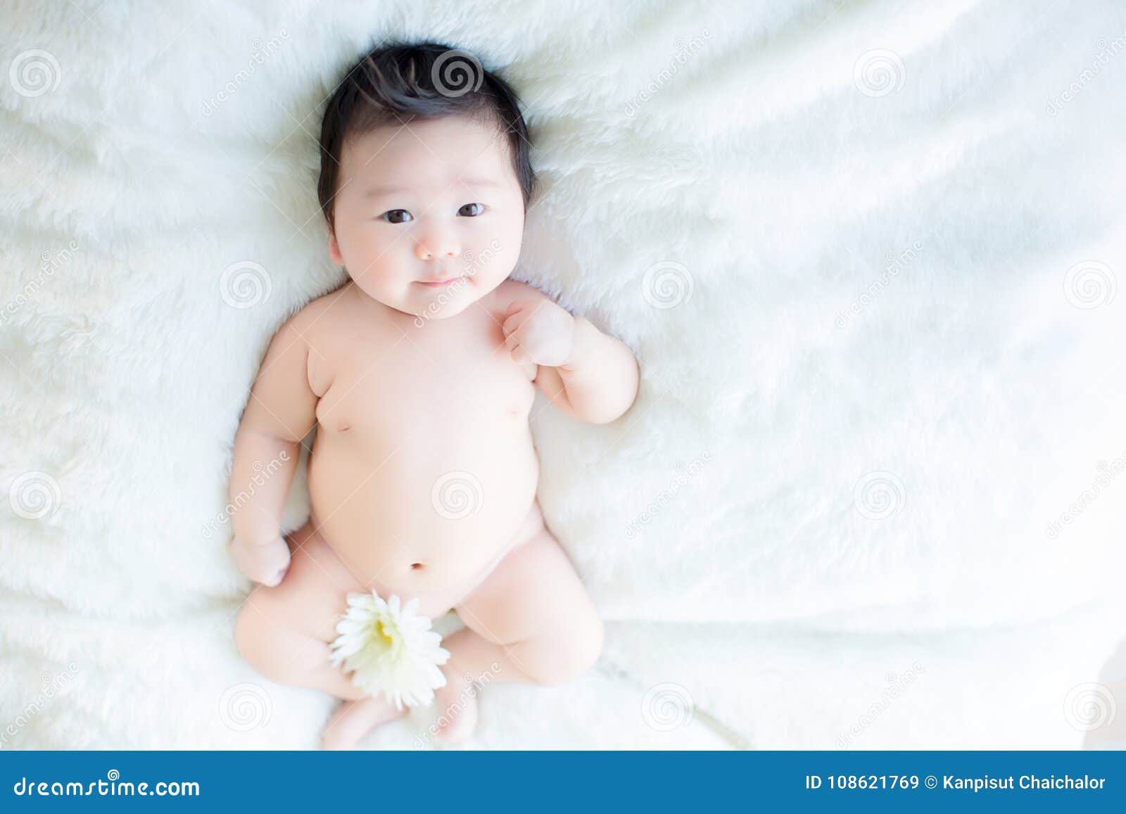 Free Photo | Newborn baby boy sleeping in beautiful room which includes  carpet flower radio and cute animal