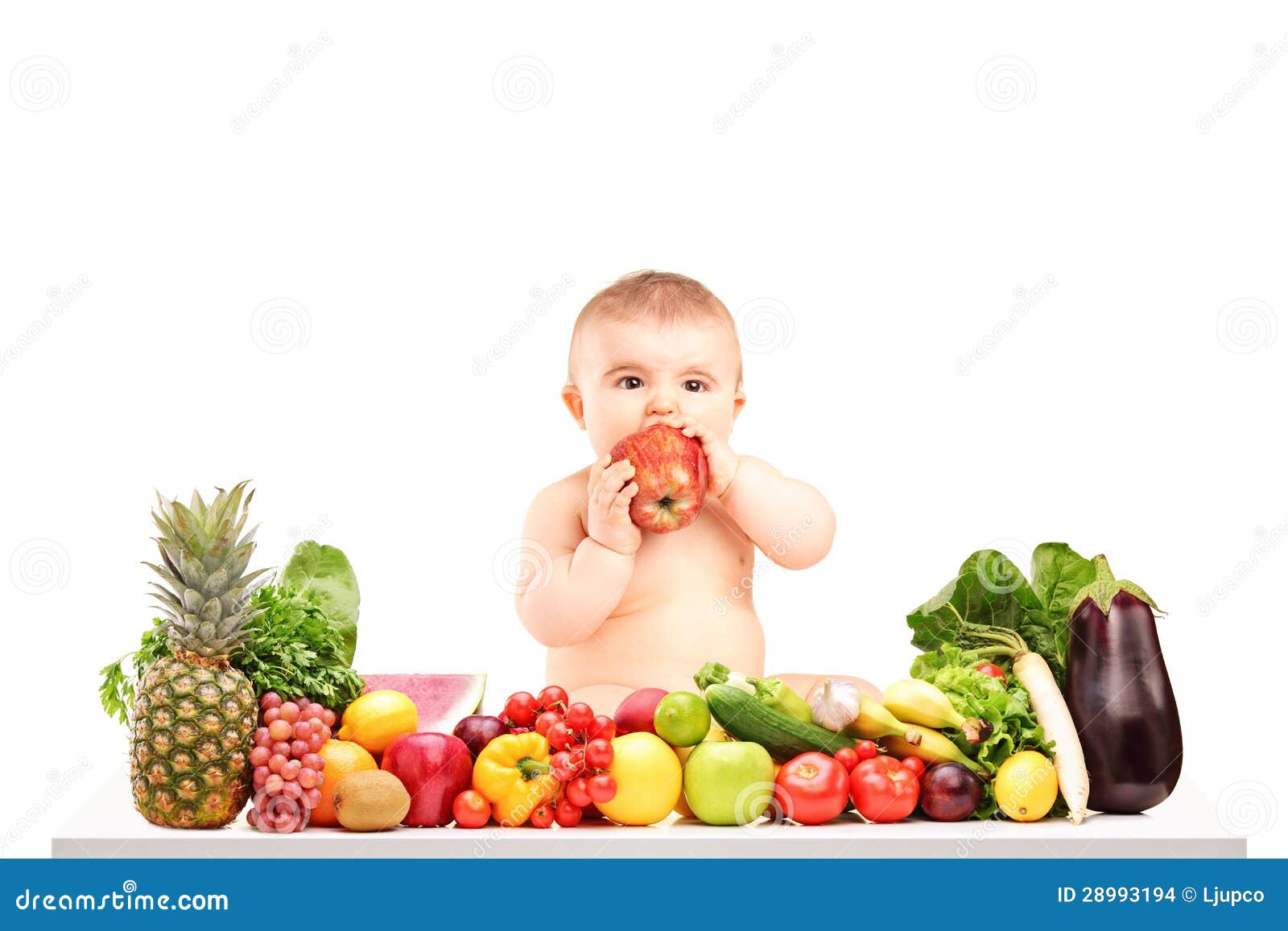 Cute Baby Boy Sitting On A Table With Fruits And ...