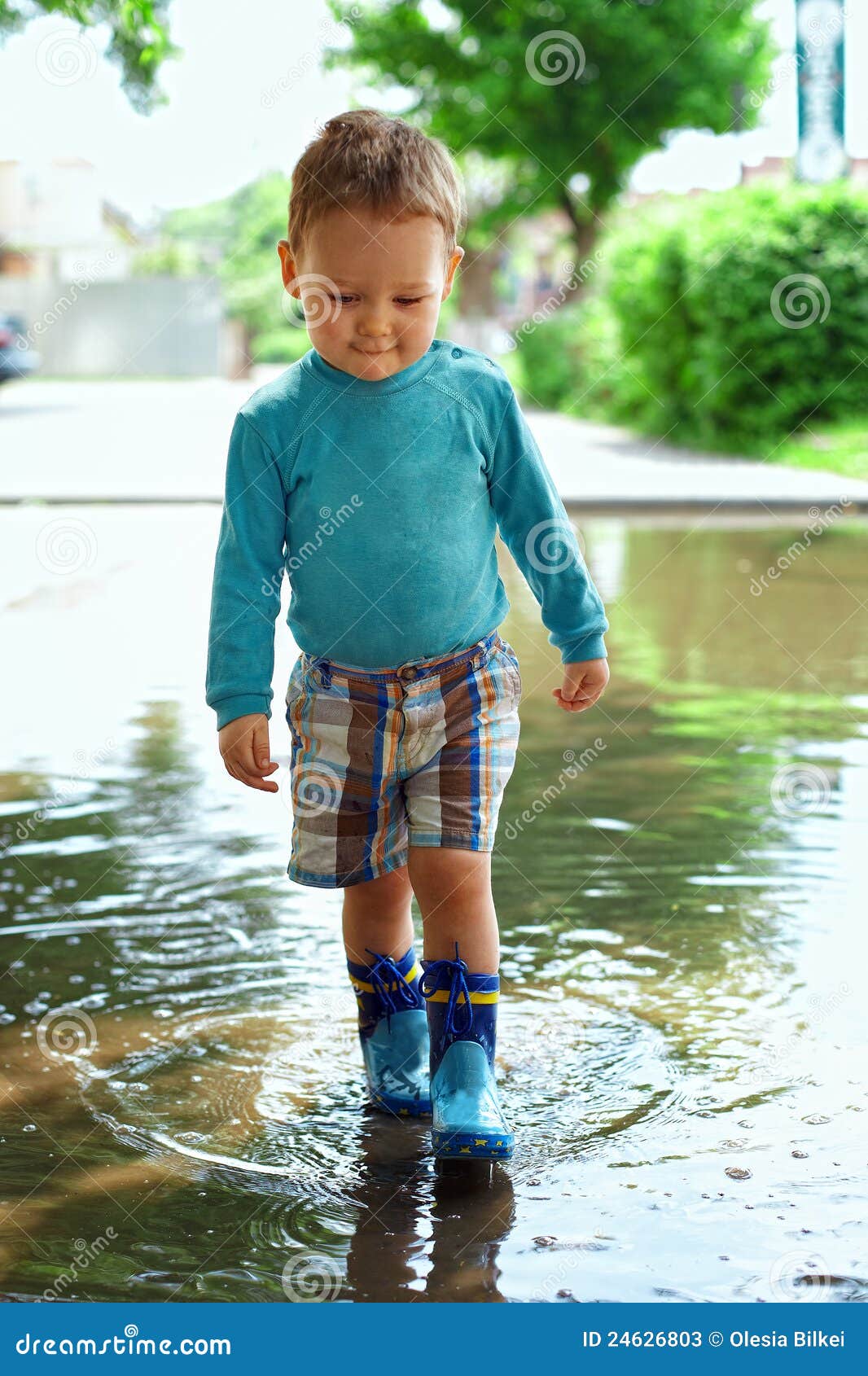 Cute Baby Boy Walking Through The Puddle Stock Photos Image 24626803