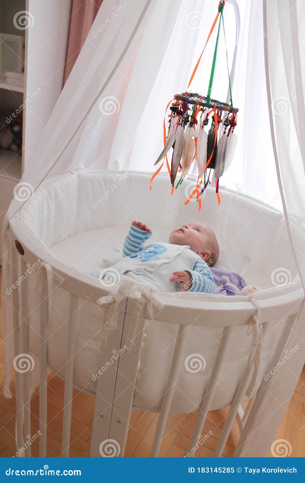 Cute Baby with a Dreamcatcher in Bed. Stock Image - Image of cute ...