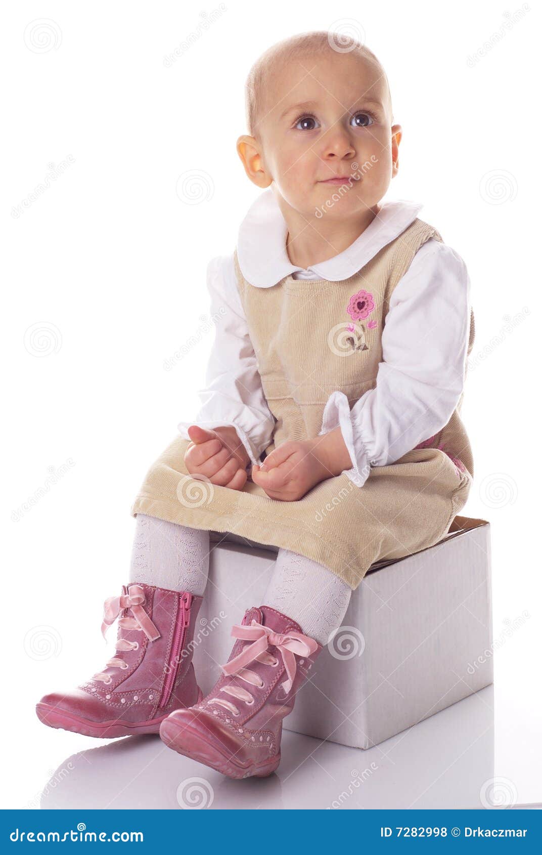 Cute baby in a dress stock photo. Image of background 7282998