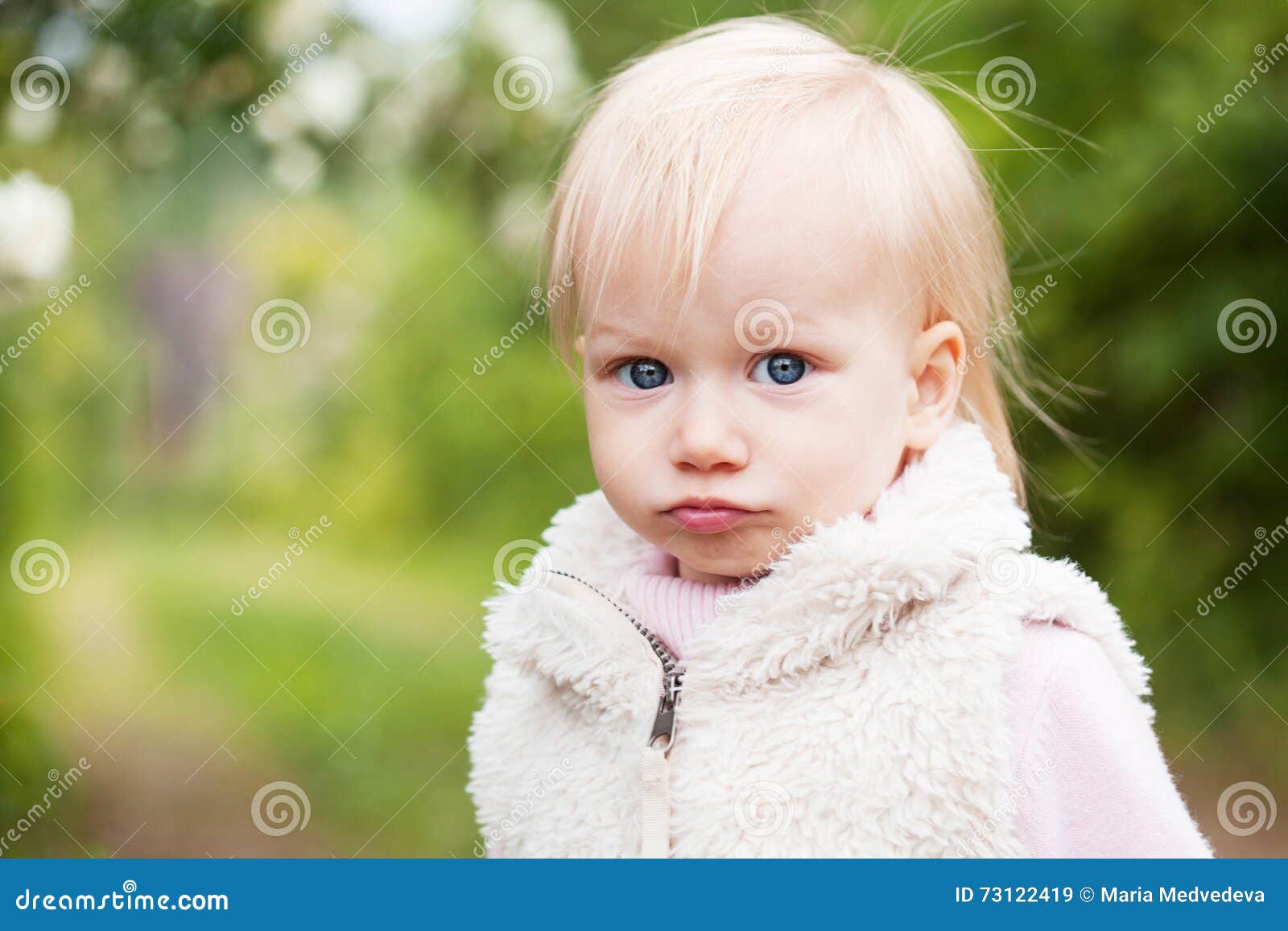 Cute Baby Girl with Blonde Hair in the Blooming Garden Stock Image - Image  of cute, blonde: 73122419