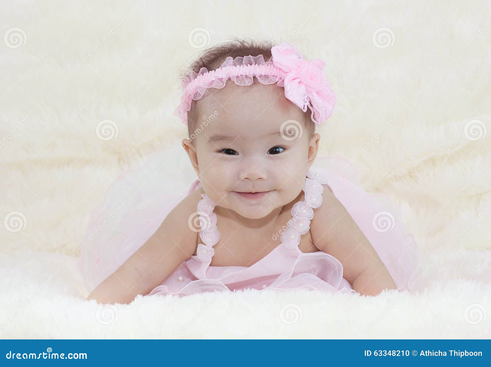 Cute Baby Girl on a Soft White Carpet. in a Beautiful Pink Dress Stock ...