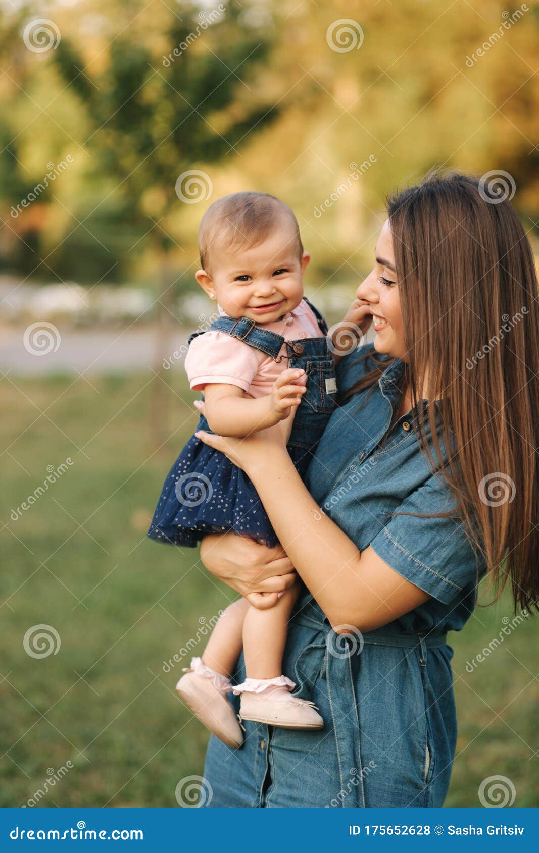 Cute Baby Girl Walking with Her Mom and Have Fun. Stylish Family ...