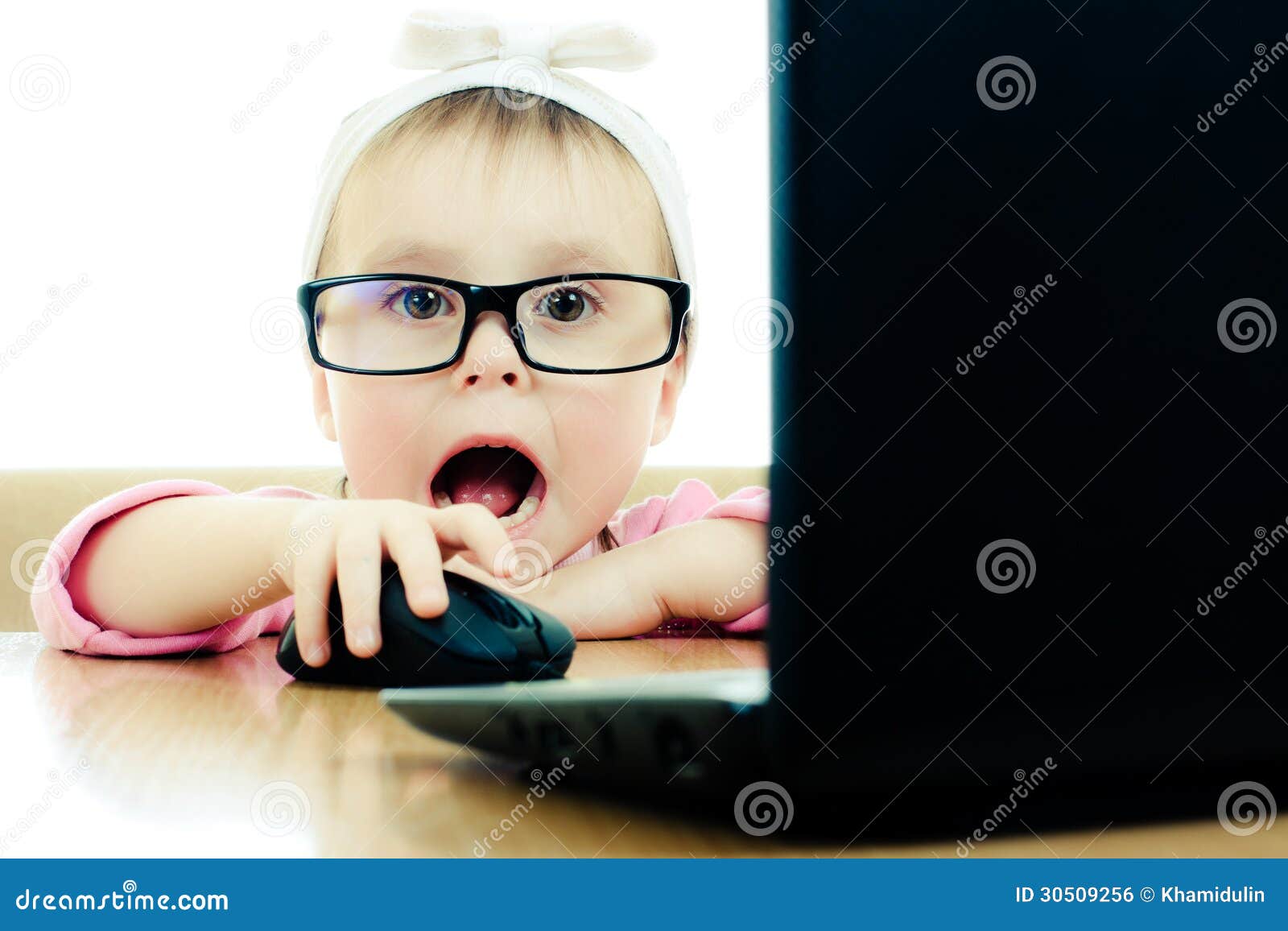 Cute Baby with Glasses Looking into the Laptop Stock Photo Image of