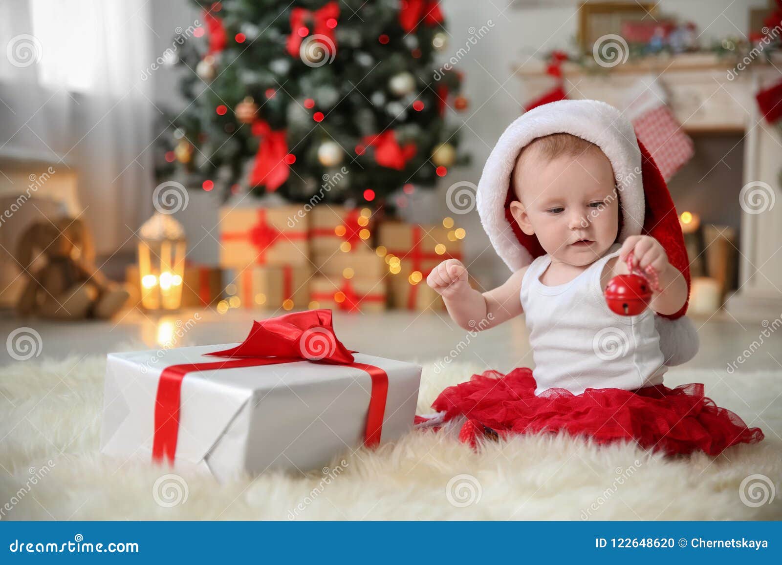 Cute Baby in Santa Hat Playing with Jingle Bell Stock Photo - Image of ...