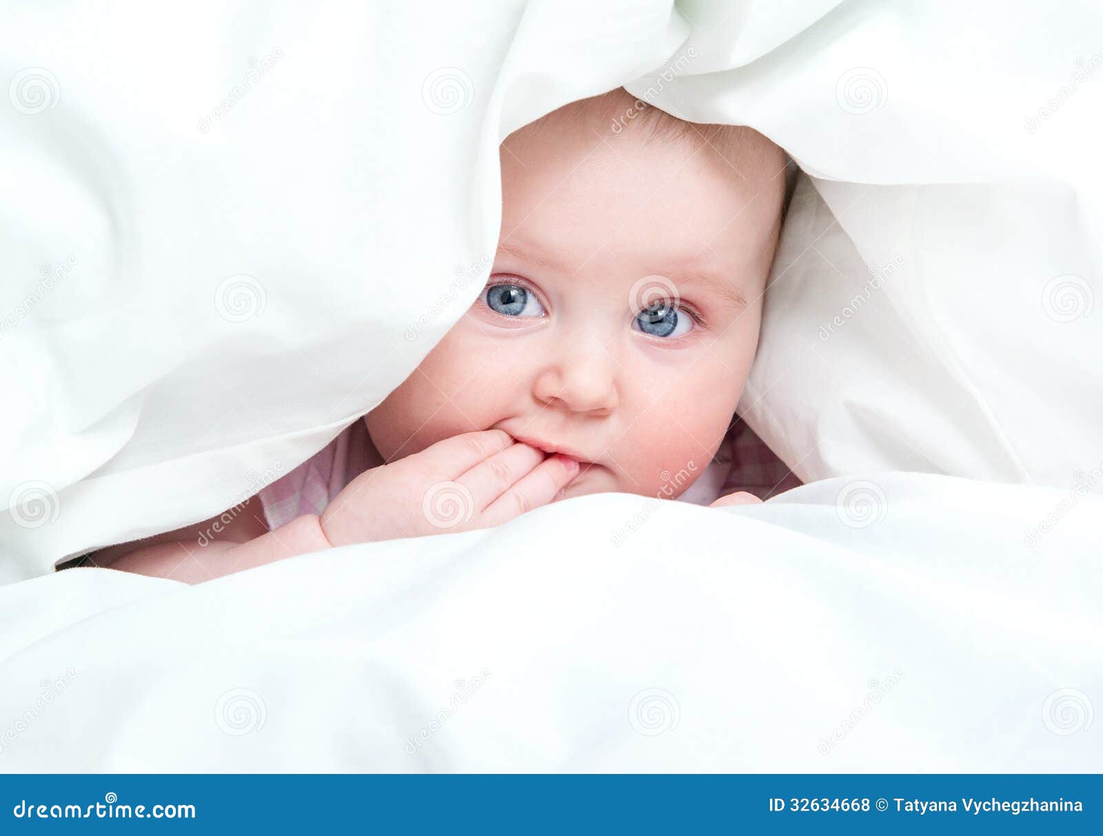 Cute Baby Sitting Between Green Blanket Stock Photo Phakimata 3126524