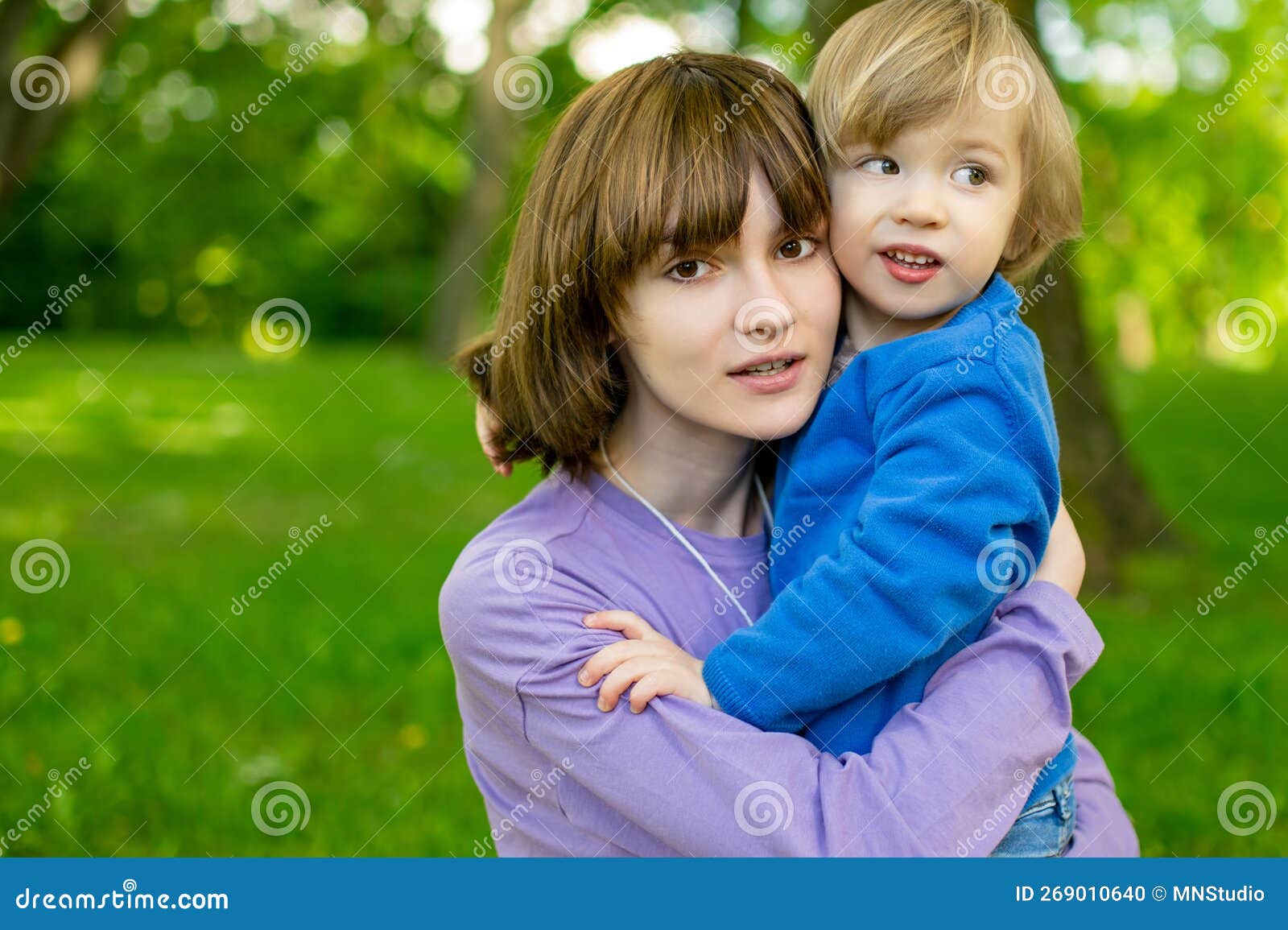 Cute Big Sister Cuddling with Her Toddler Brother. Adorable Teenager