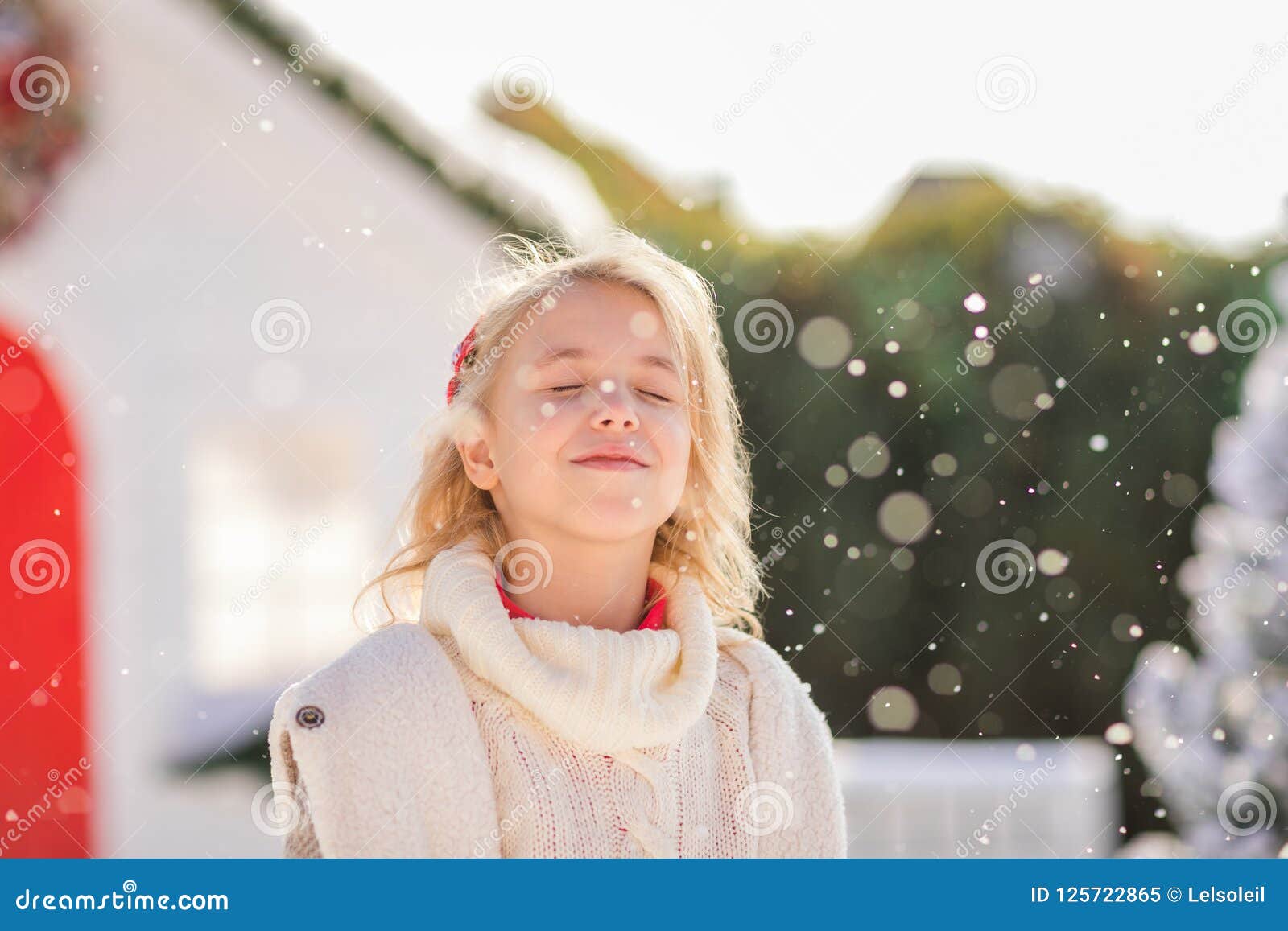 Cute Blonde Girl Near The Small House And Snow Covered Trees New Year