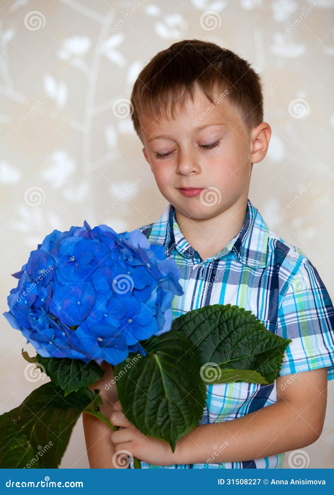 Cute boy with blue flowers stock image. Image of spring 31508227