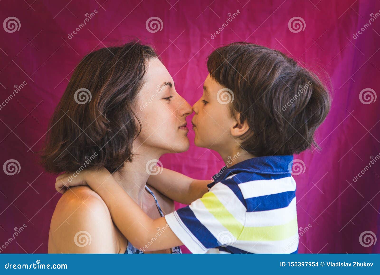 Cute Boy Kisses and Hugs Mom Stock Photo - Image of embrace ...