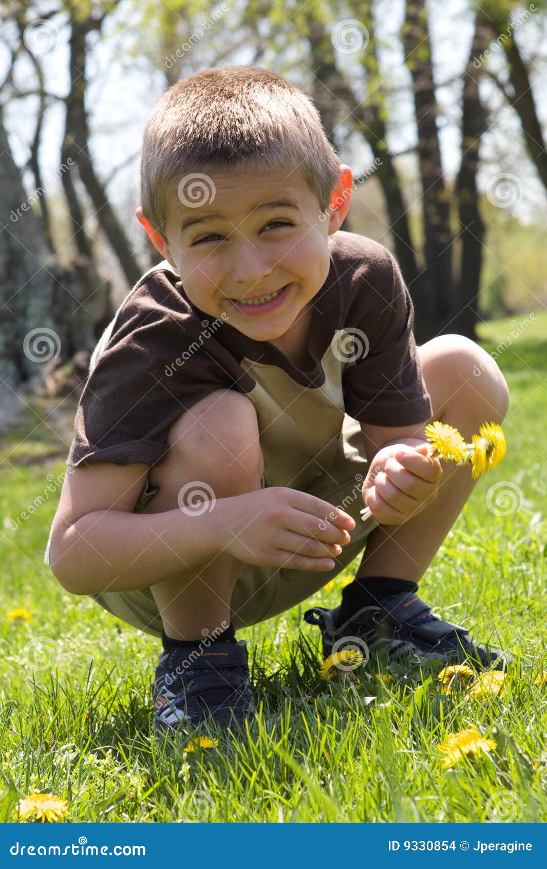 Cute Boy Picking Flowers stock photo. Image of happy, people 9330854