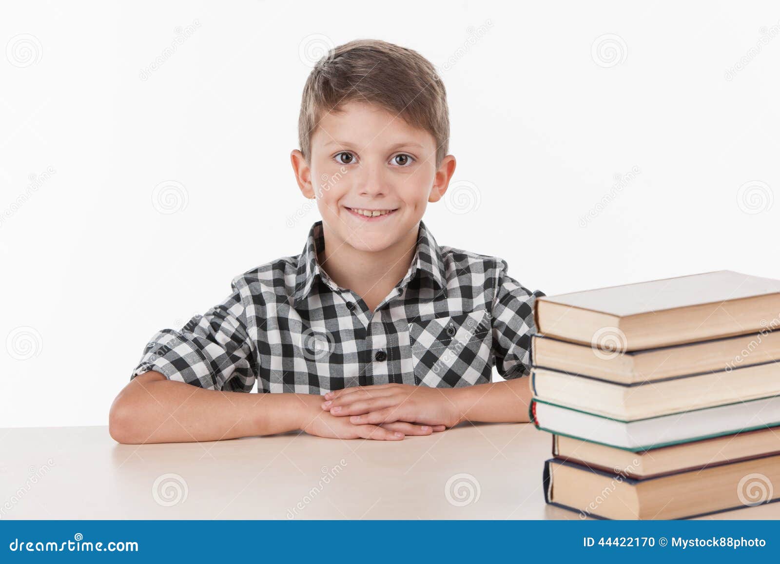 Cute Boy Sitting at Table and Smiling. Stock Photo Image of adorable