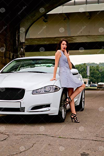 Cute Brunette and Luxury Car Stock Photo - Image of eyes, elegance ...