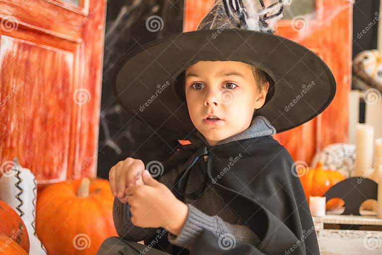 Cute Caucasian Boy in Carnival Wizard Costume on Haloween Decor Stock ...