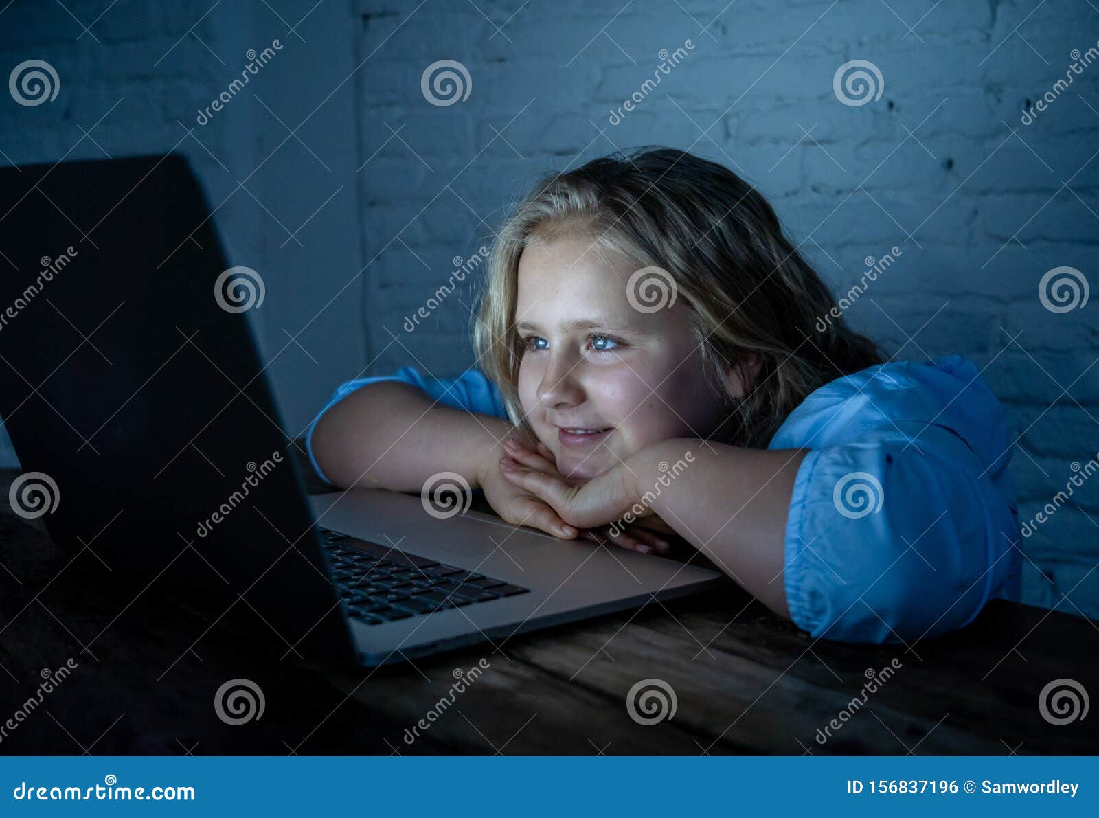 Woman playing online poker late at night