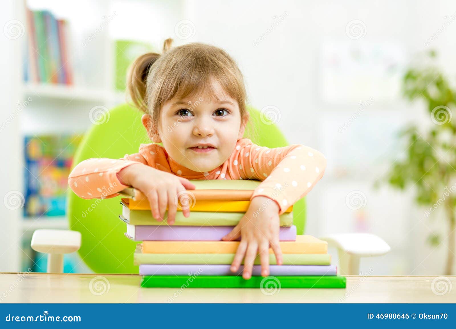cute child girl preschooler with books