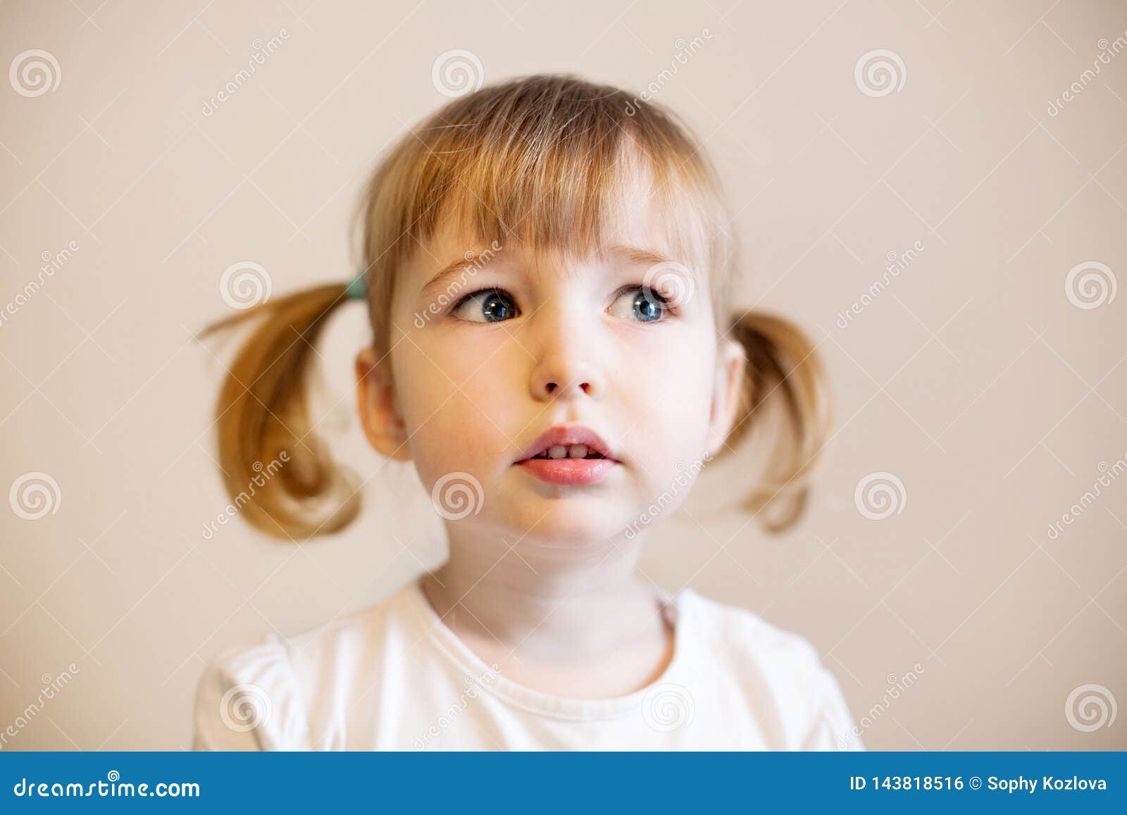 Cute Child Girl With Two Pigtails And Quiff Of Blonde Hair Stock