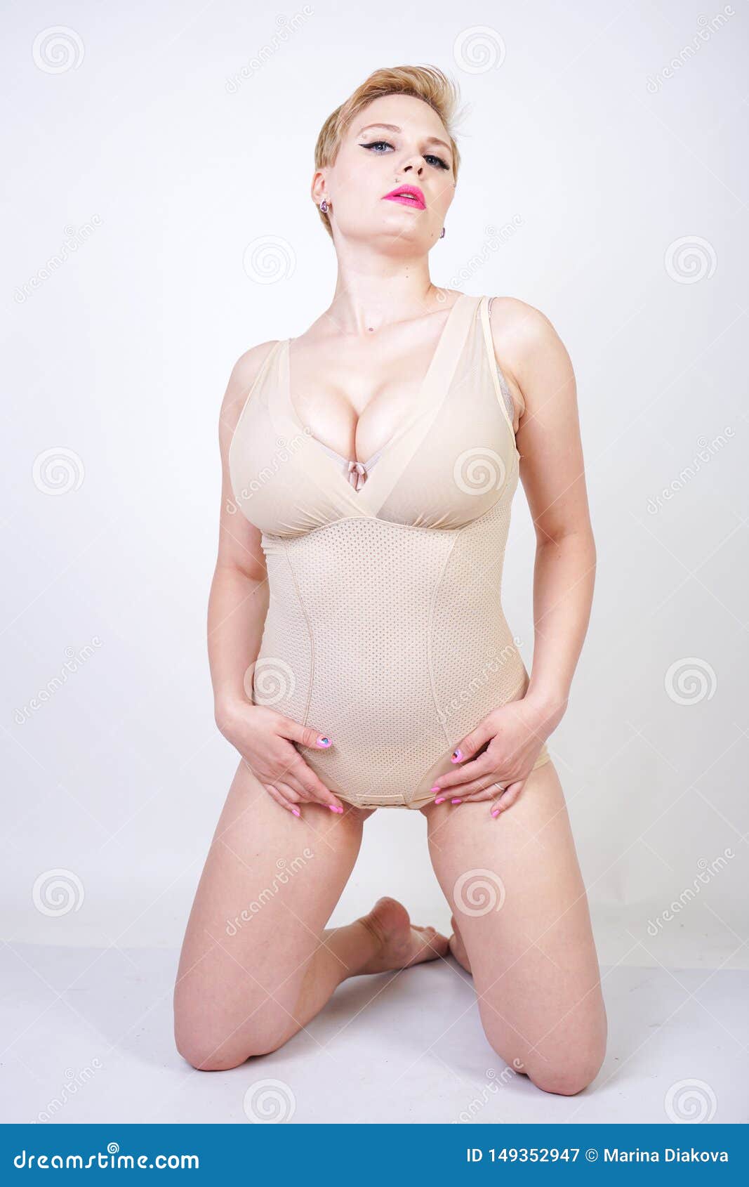 Cute Chubby Girl with Short Hair and a Curvy Figure Dressed in Beige Tight  Shapewear on a White Background in the Studio Stock Image - Image of  background, bodypositive: 149352947