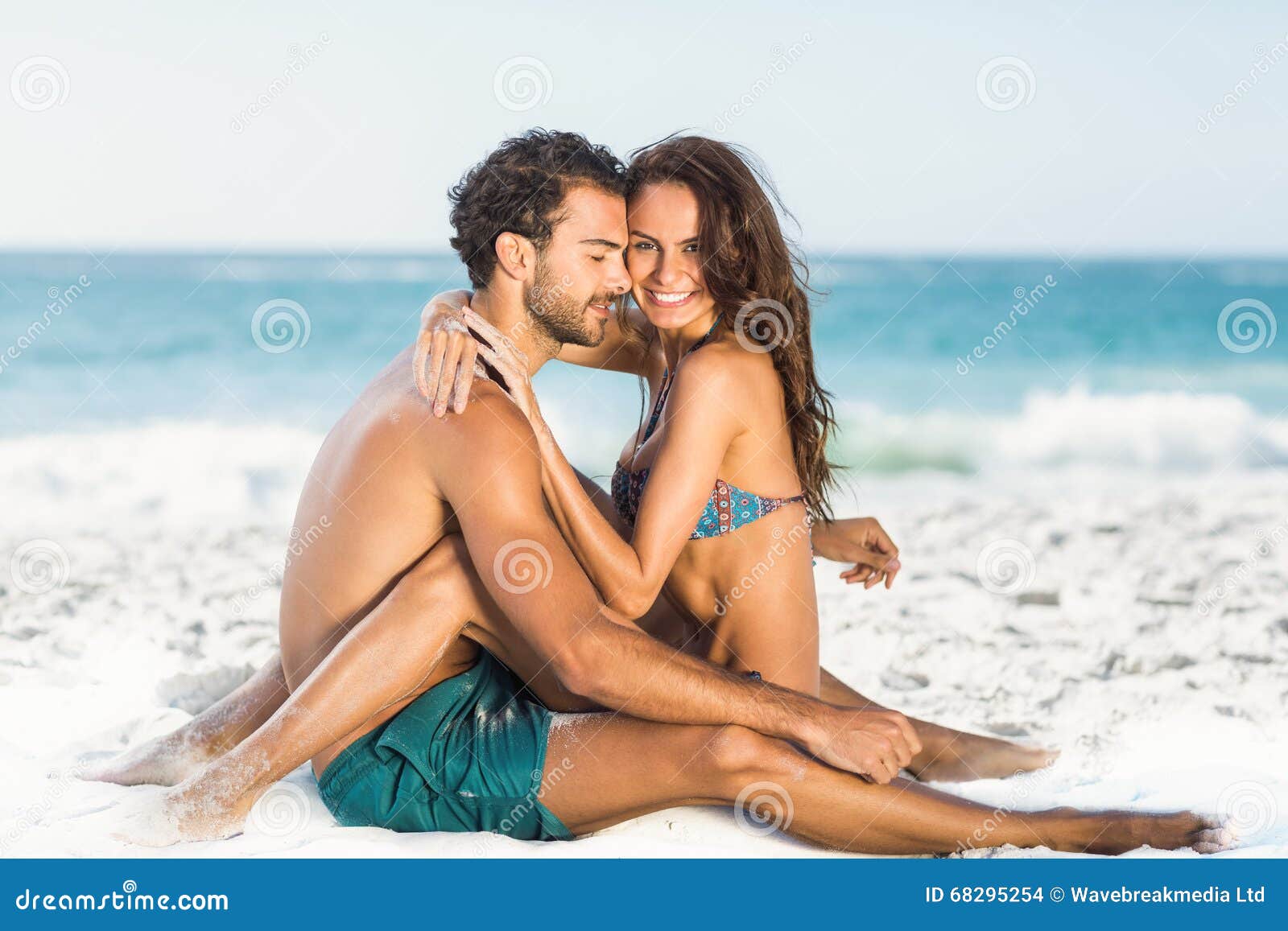 Cute Couple Hugging Sitting on the Beach Stock Photo - Image of ...