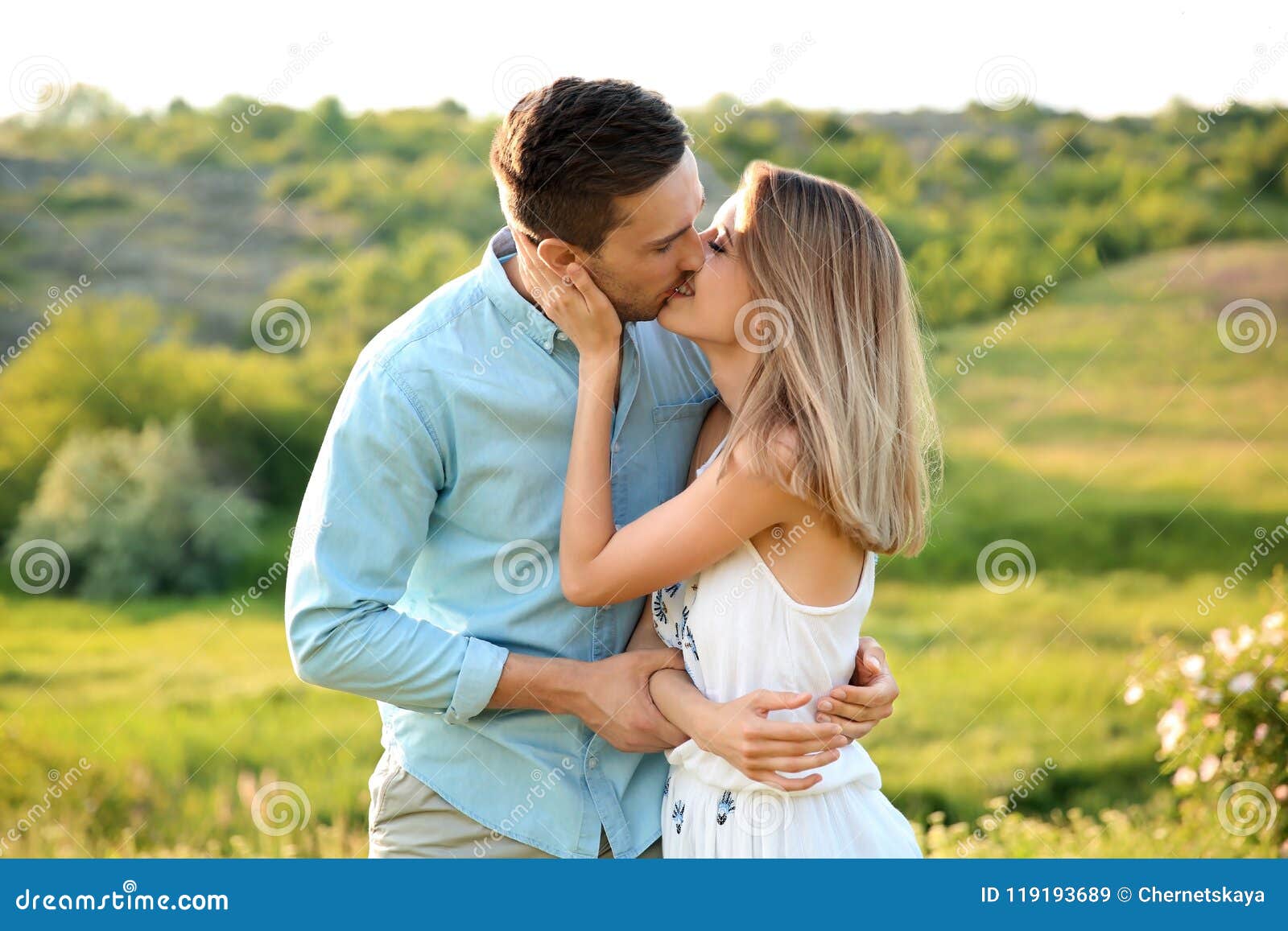 Cute Couple In Love Posing Outdoors On Sunny Day Stock Image