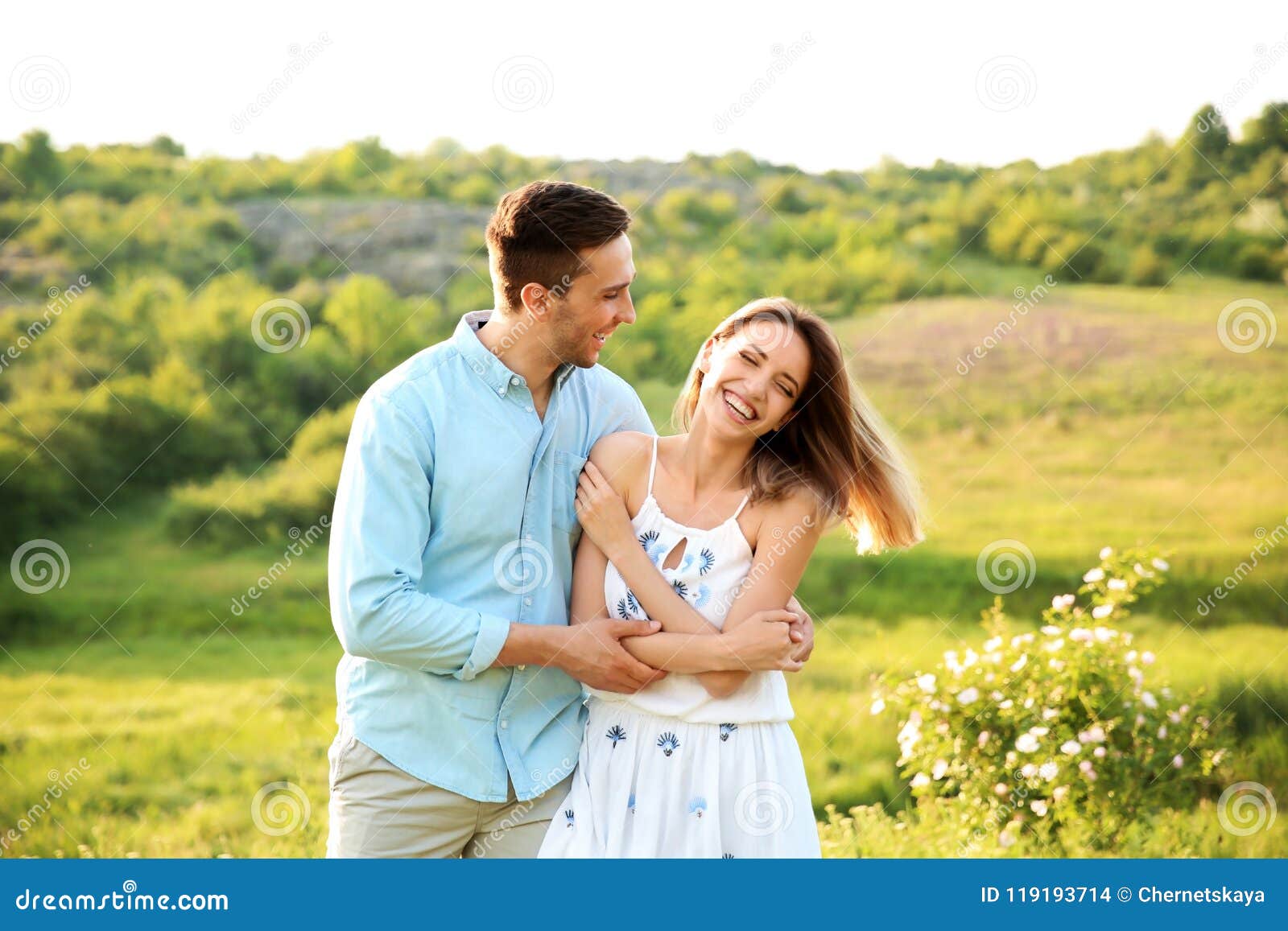 Cute Couple In Love Posing Outdoors On Sunny Day Stock Photo
