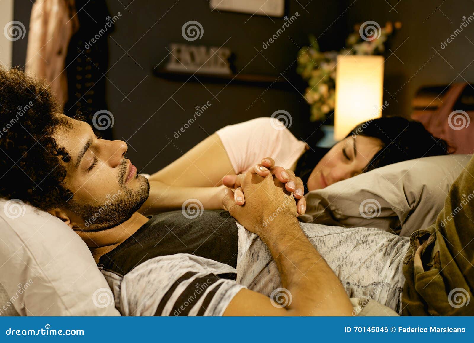 Cute Couple in Love Sleeping in Bed Holding Hands at Home at Night ...