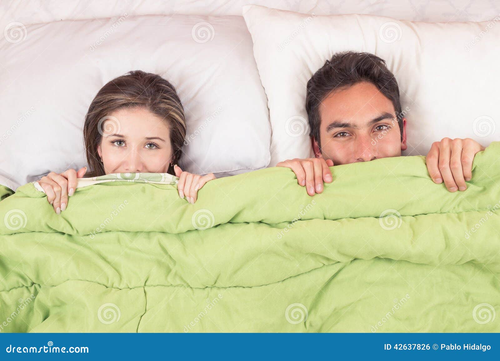 Cute Couple Lying In Bed Under The Covers Stock Photo Image 42637826