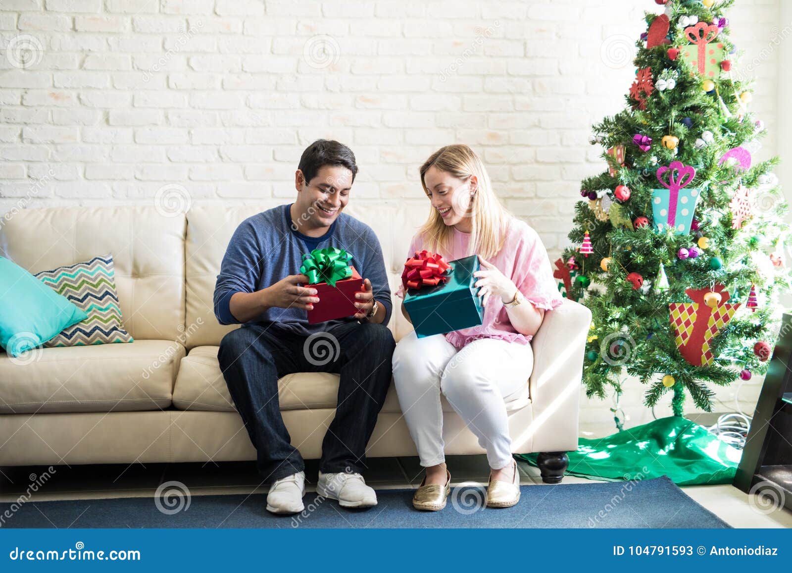 cute couple opening christmas