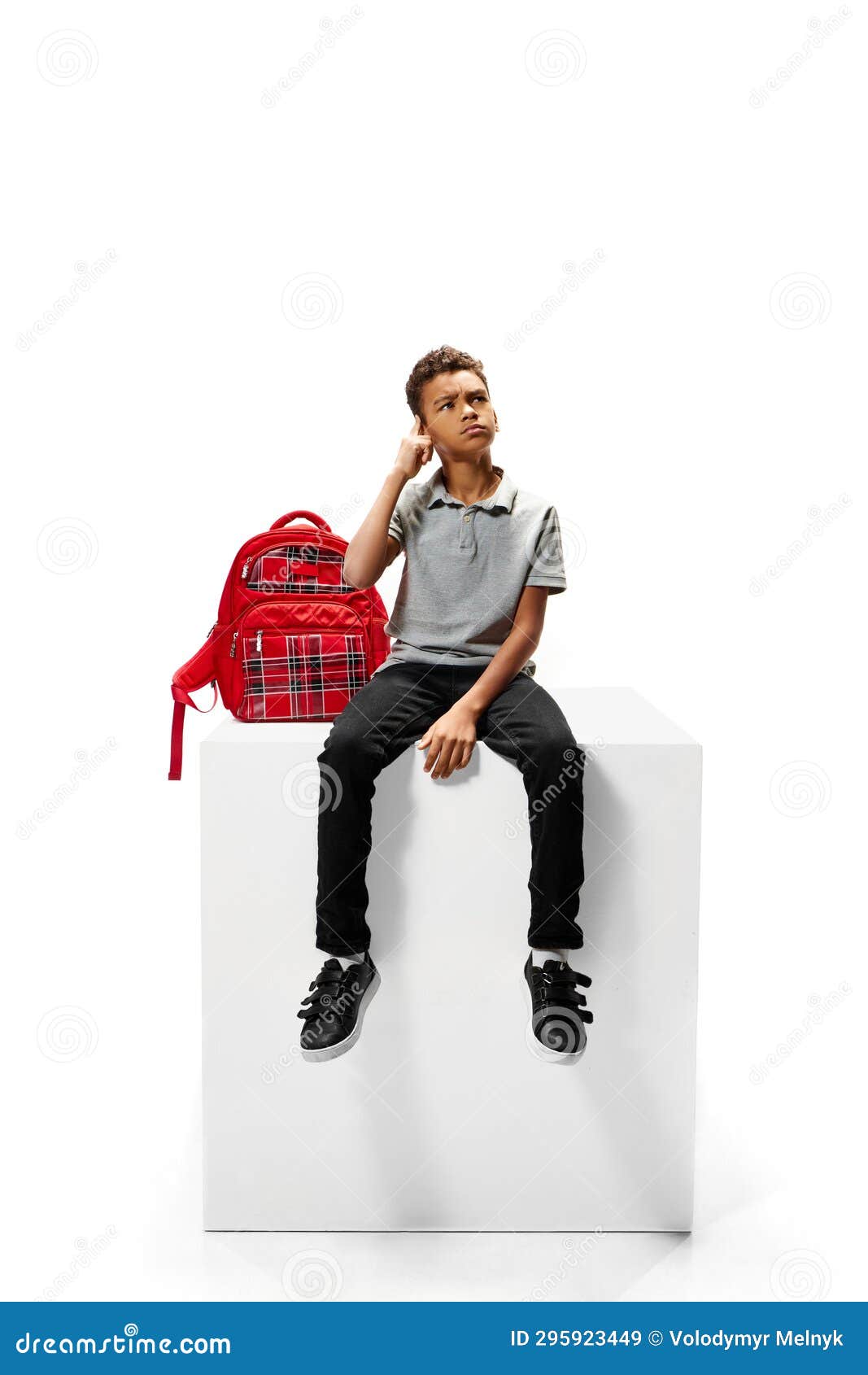 Cute Curly African-American Boy Sitting on Stage and Dreaming about