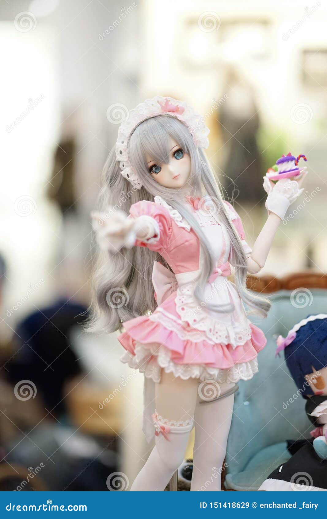 Cute Doll on Display. a Portrait Photo of a Maid Girl Wearing a ...