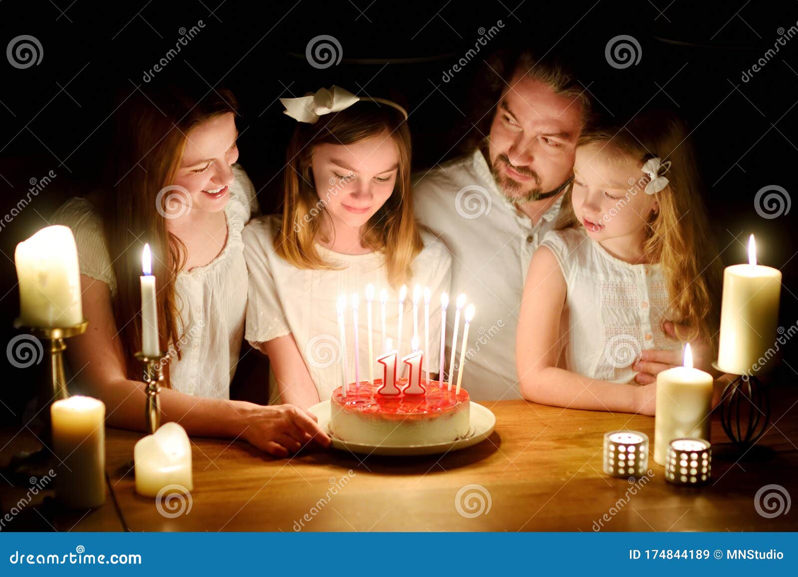 Cute Eleven Years Old Girl Making a Wish before Blowing Candles on Her ...