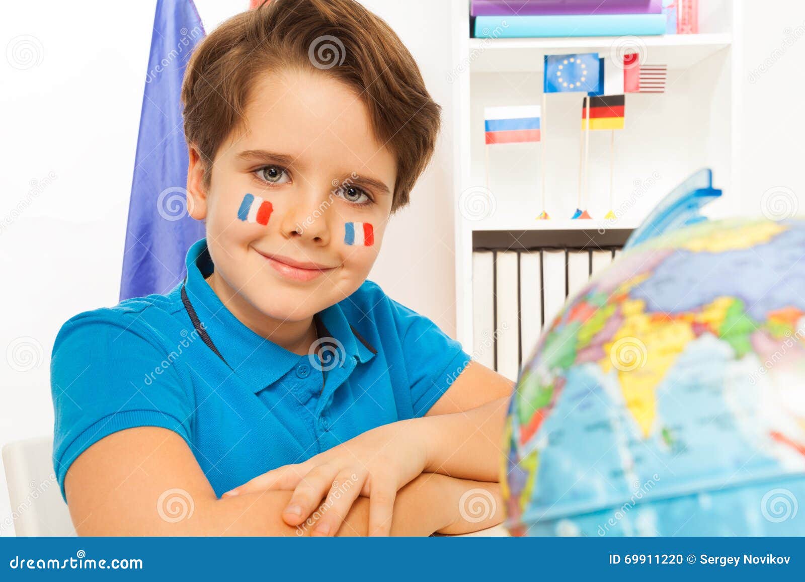 Cute French Boy Learning Geography with the Globe Stock Photo Image