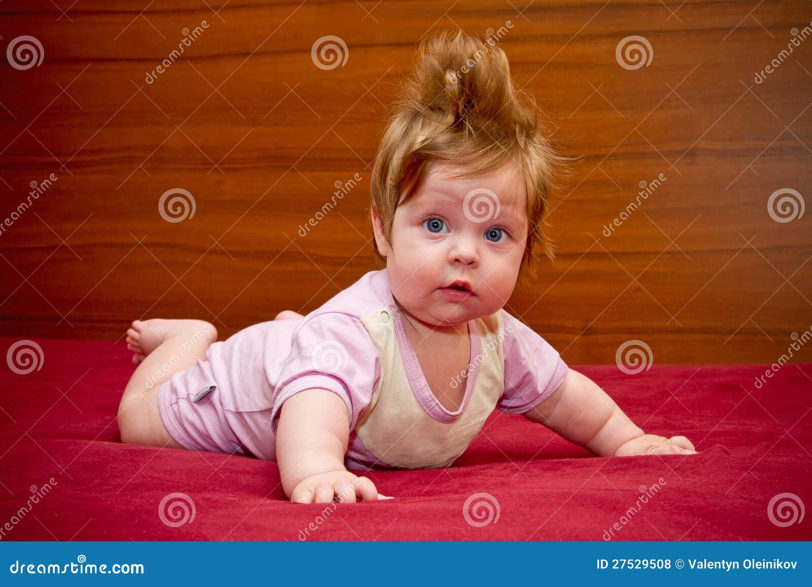 cute funny baby girl with cheerful coiffure