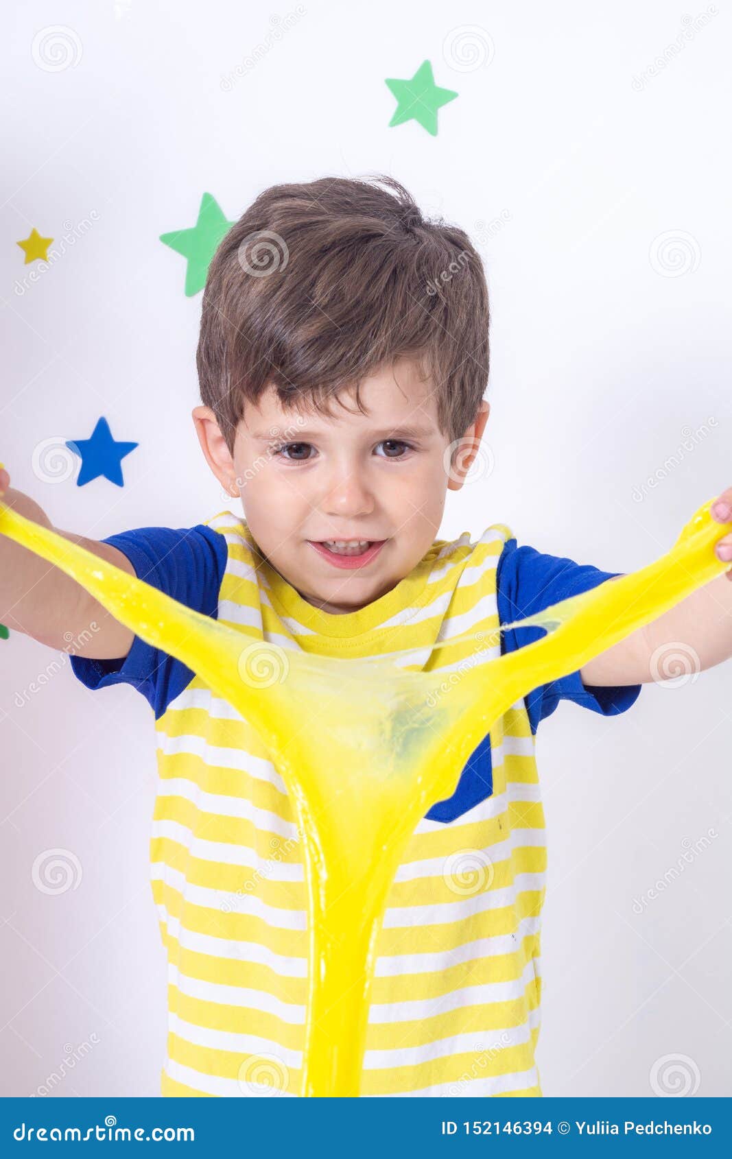 cute funny boy play with slime.