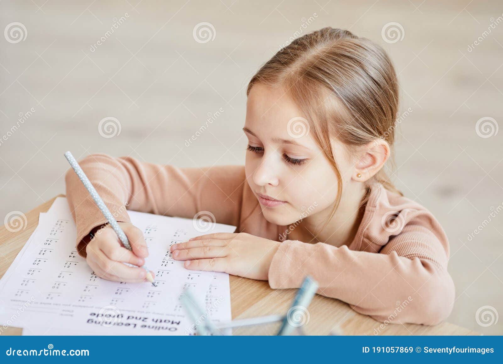 child doing math homework