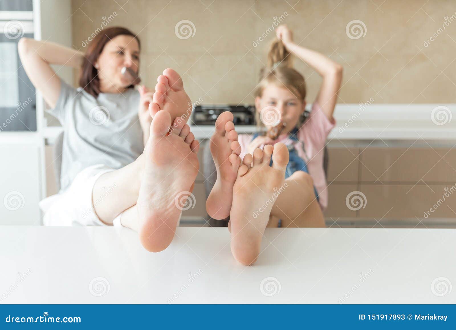 Cute Little Girl And Mother On Bed Reading Royalty-Free Stock Image