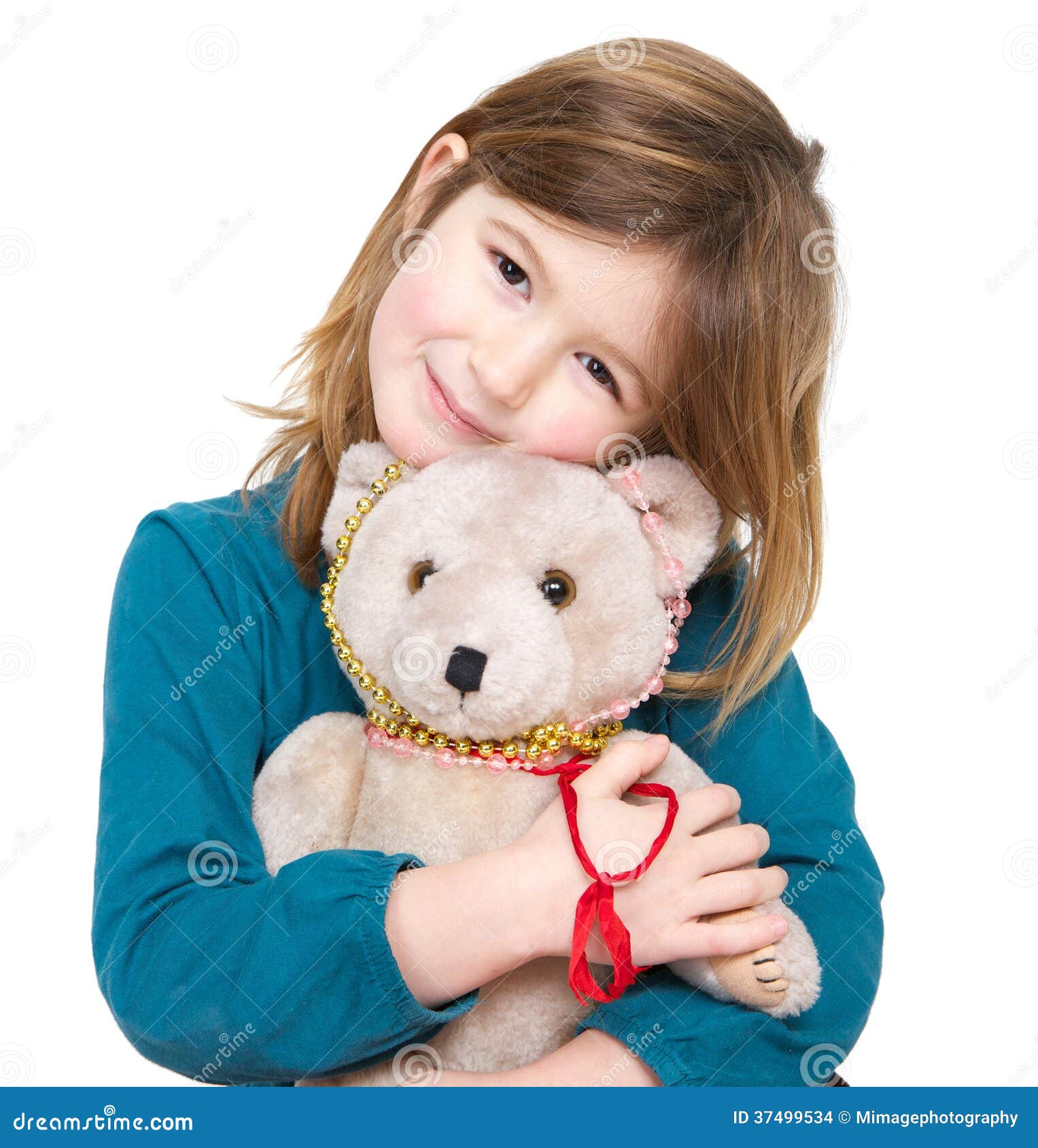 girl holding a teddy bear