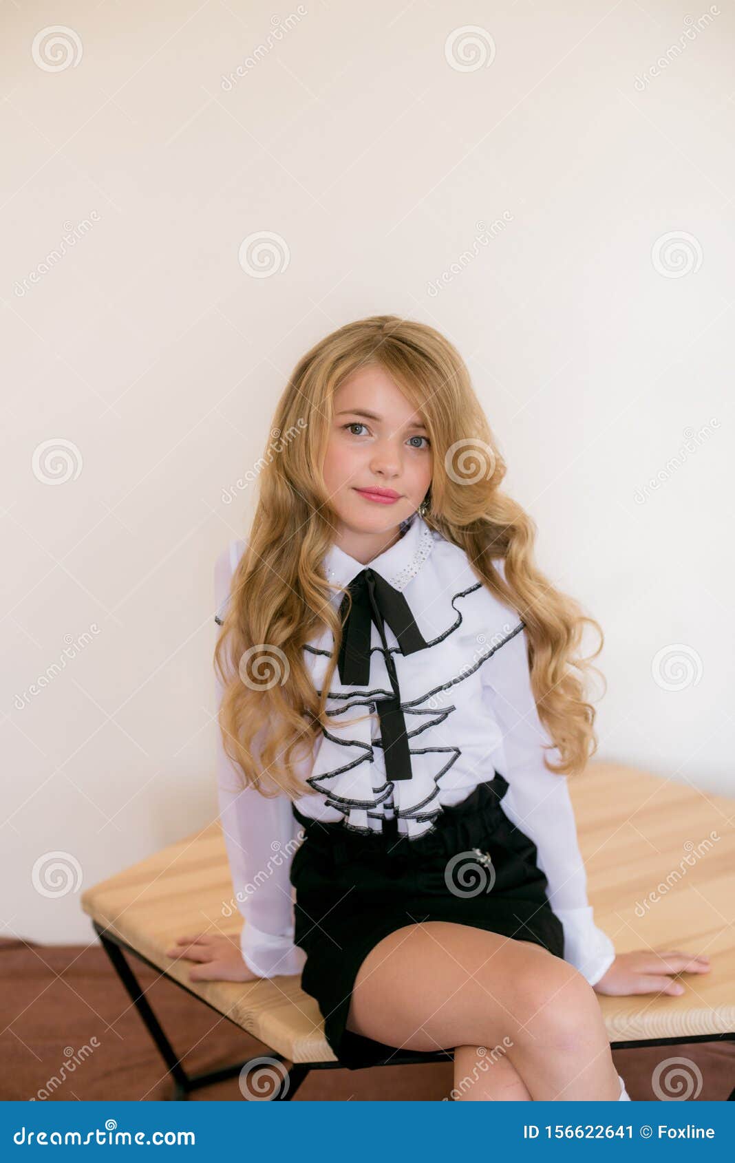 Cute Girl with Long Blond Curly Hair in School Fashion Clothes. School ...