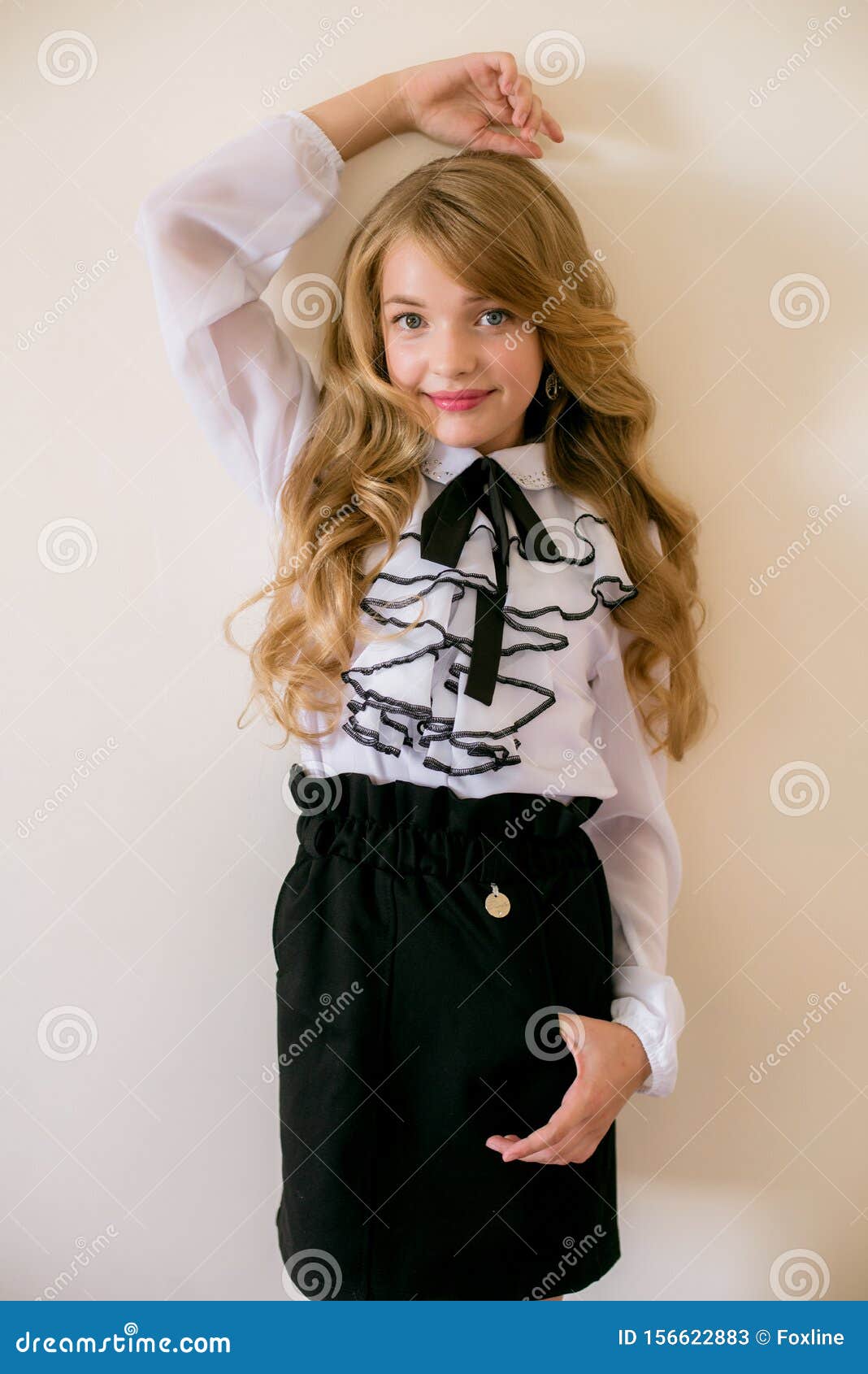 Cute Girl with Long Blond Curly Hair in School Fashion Clothes. School ...