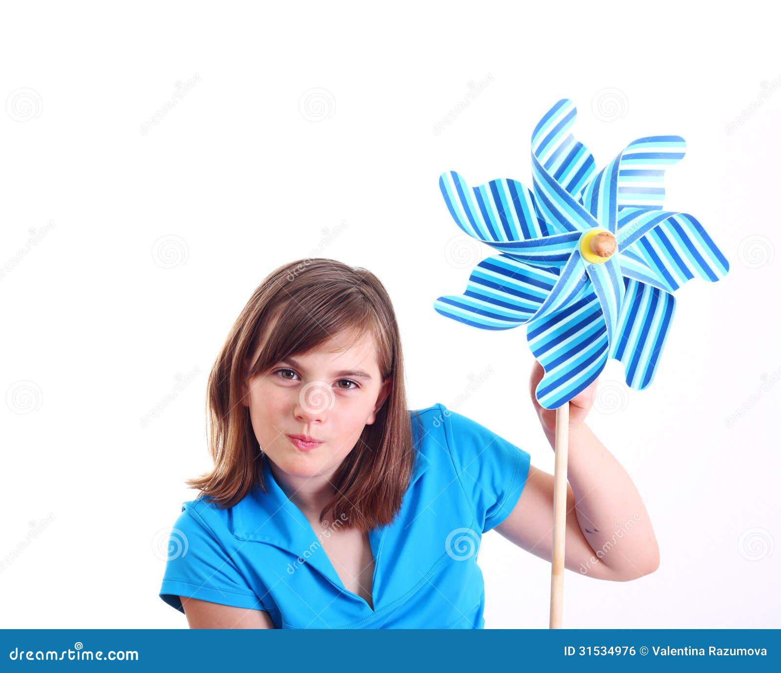Cute girl with pinwheel stock photo. Image of female 31534976
