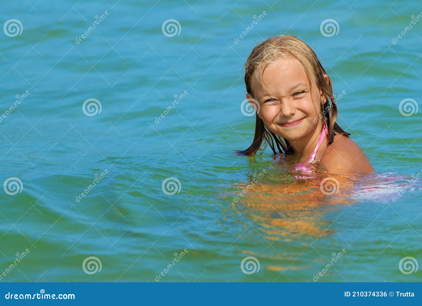 Cute Girl Playing in the Sea Stock Photo - Image of blue, playing ...