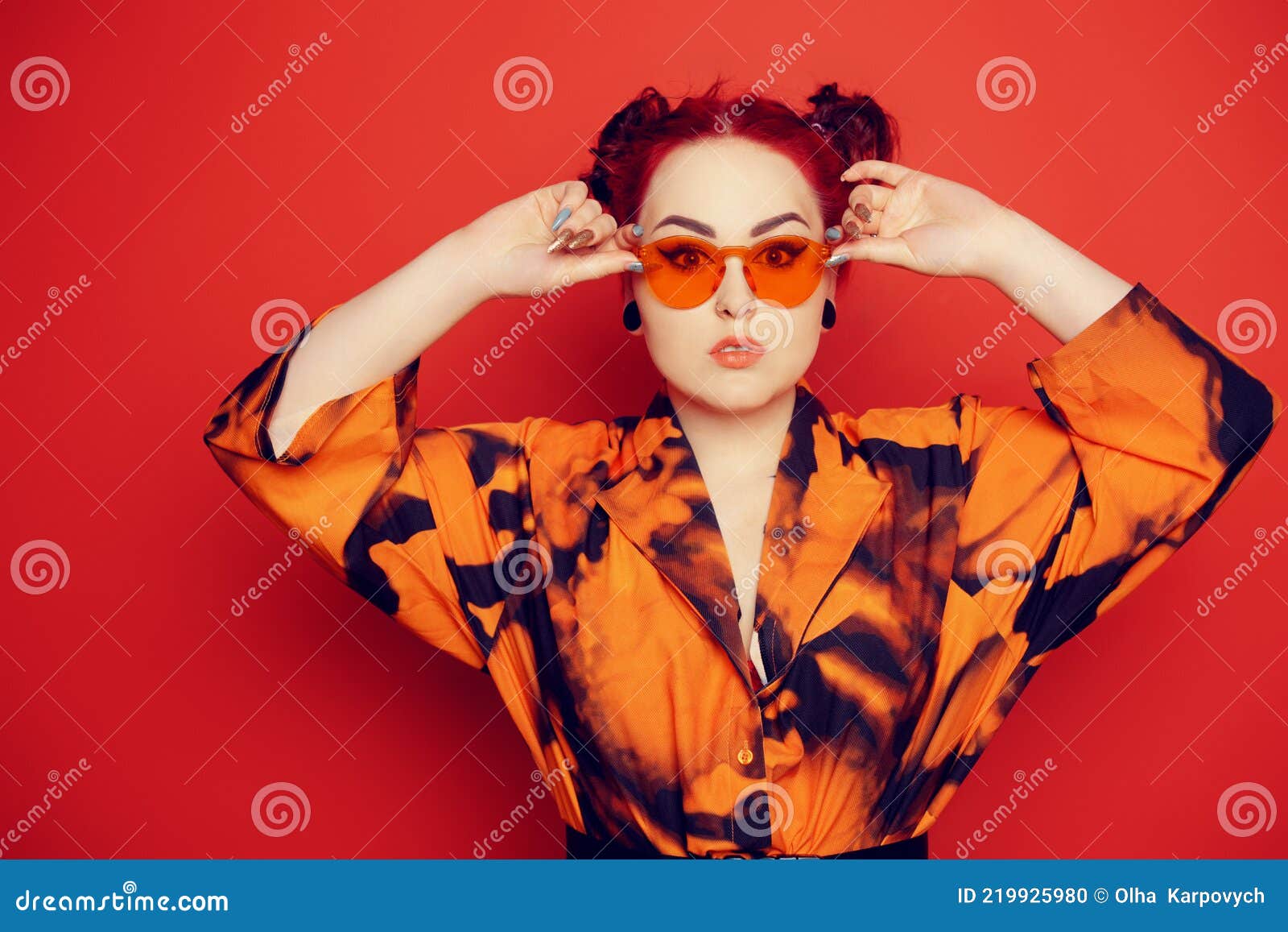 cute girl red background hair tunnels ears dress lips anime poses orange sunglasses two buns her head looks 219925980
