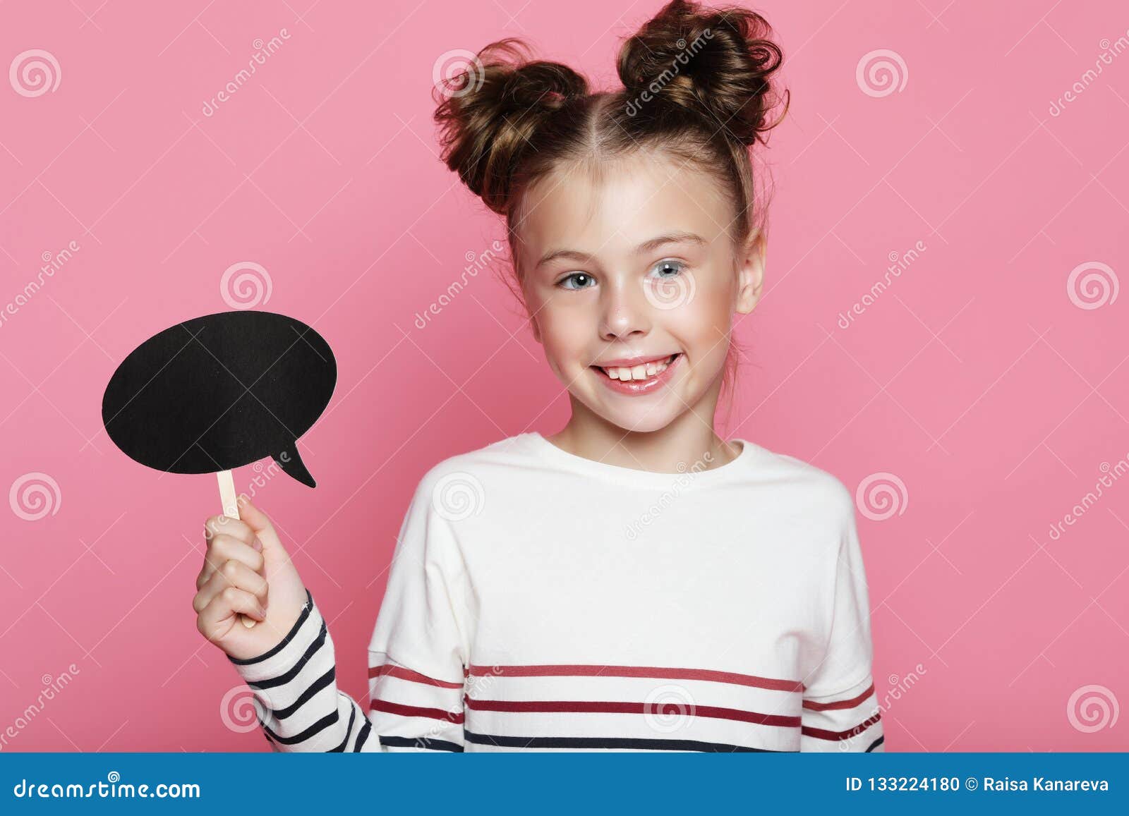 Cute Girl 7-8 Year Old Posing In Studio Over Pink Background Stock