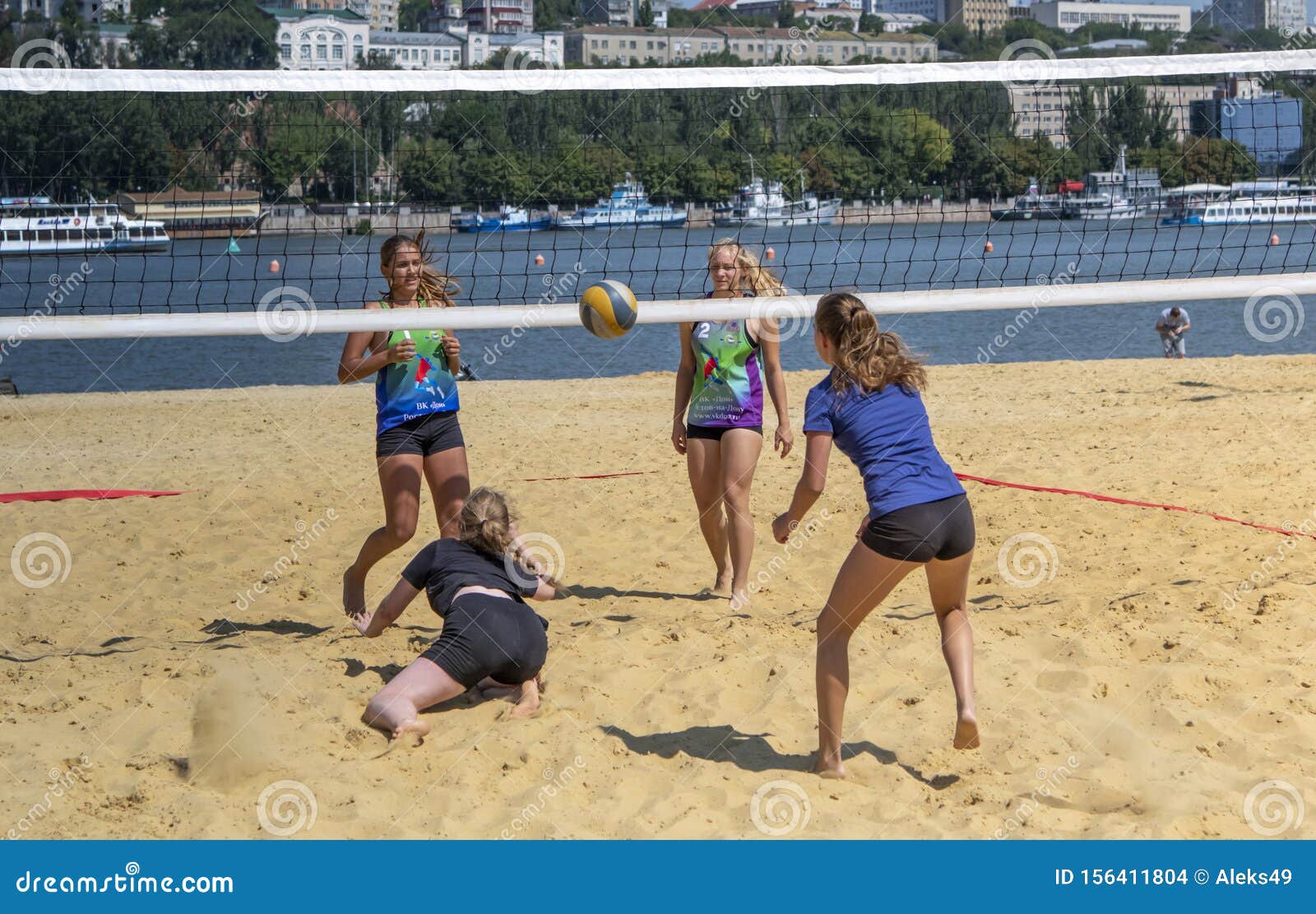 Cute Girls Play Beach Volleyball