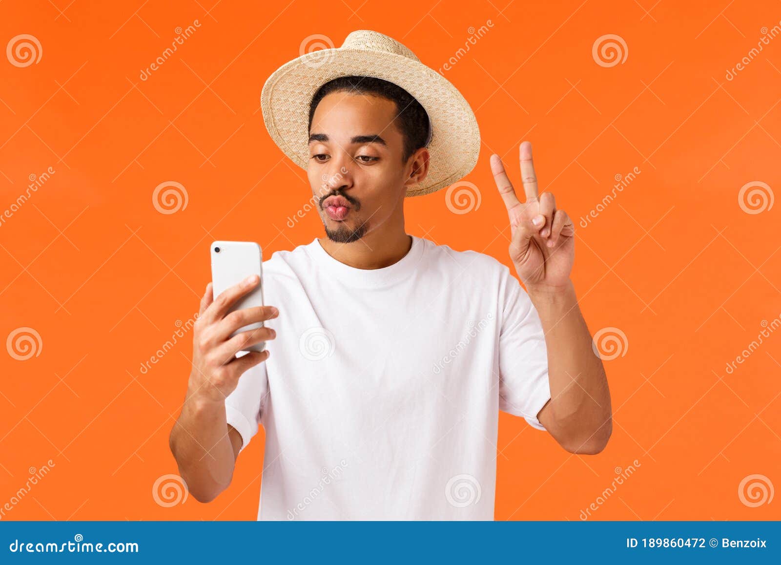 Cute And Happy African-american Guy In White T-shirt, Summer Hat, Showing Peace Sign, Taking Selfie With Filter Fold Stock Photo - Image of nomad, attractive: 189860472 Cute And Happy African-american Guy In White T-shirt, Summer Hat, Showing Peace Sign, Taking Selfie With Filter Fold Stock Photo - Image of nomad, attractive: 189860472