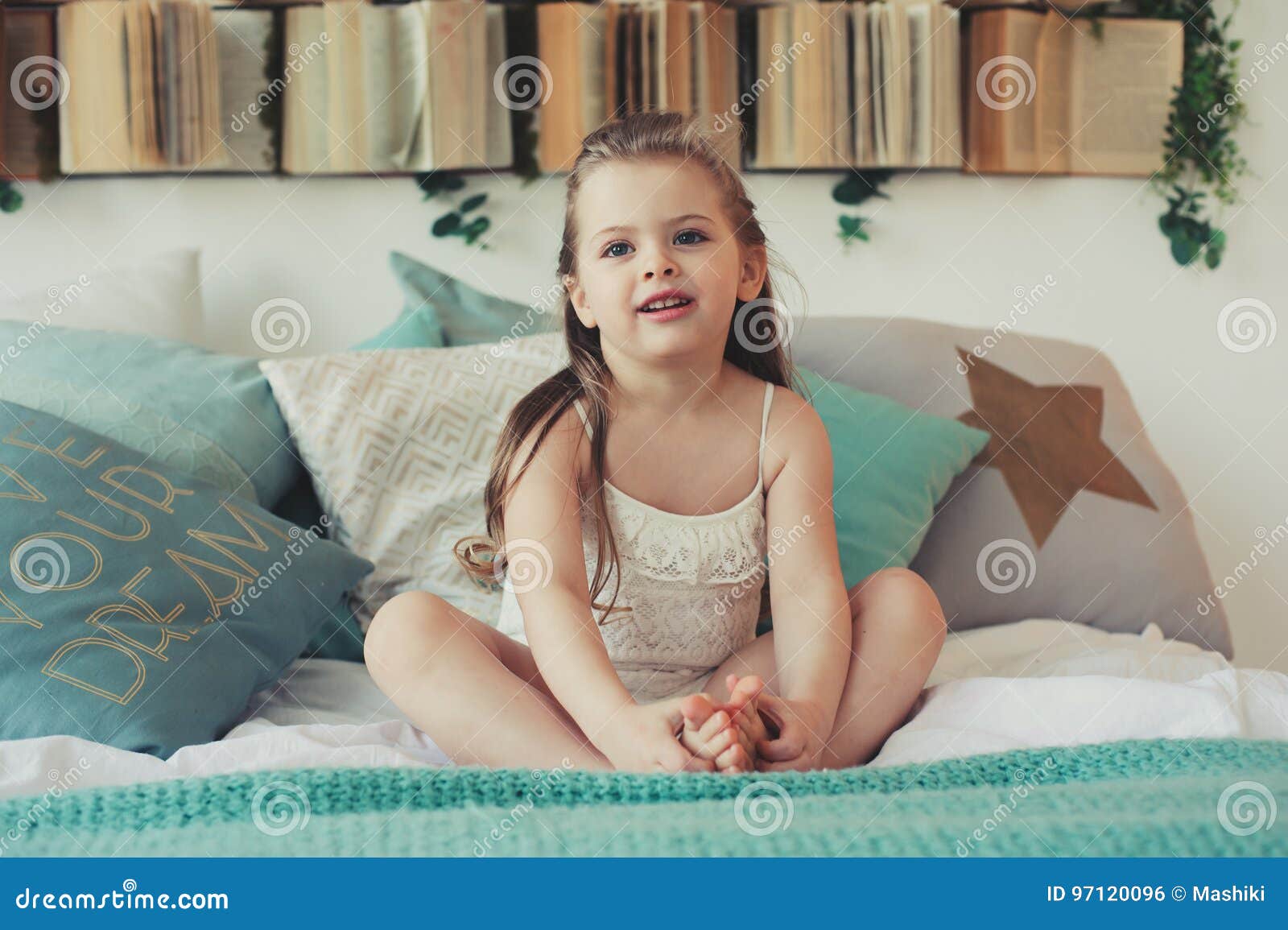 Cute Happy Toddler Girl Sitting on Bed in Pajama. Child Playing at Home ...